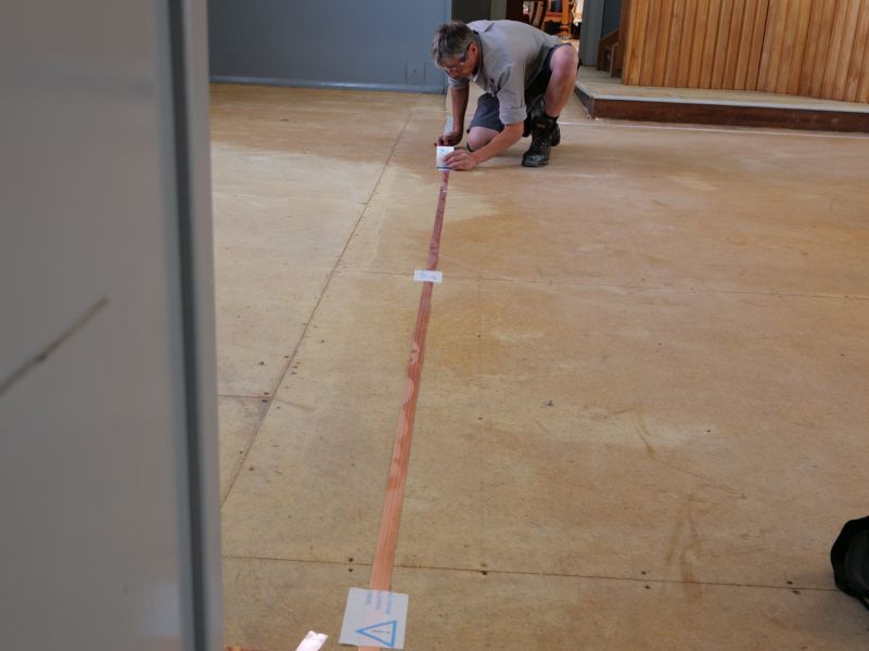 Our project manager Kevin Moylan installs hearing loop foil at the Reformed Church Dunedin