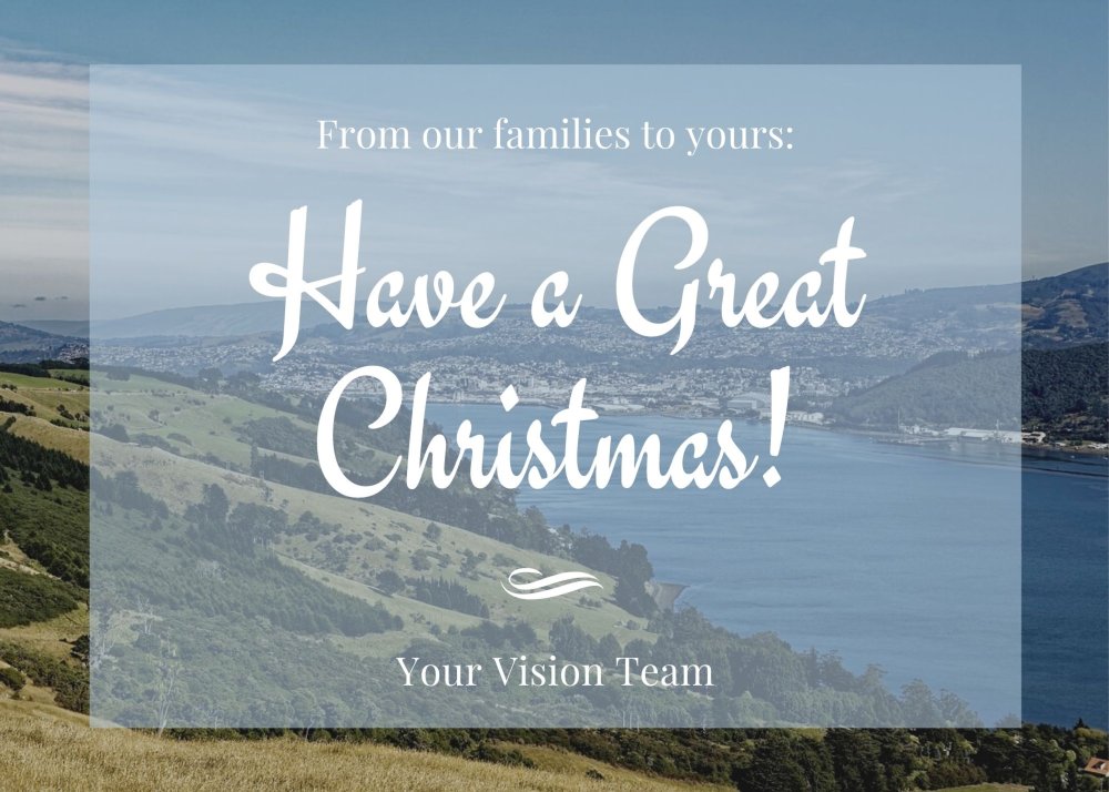 Aerial view of Dunedin and Otago Harbour in the background, seasons greetings overlay