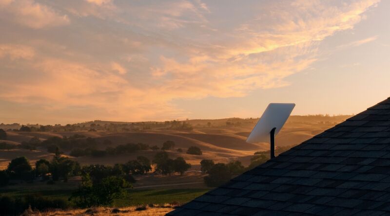 Upgraded Starlink dish on a rooftop with evening sky in the background