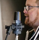 Breesy in his studio with the AKG C414XL condenser microphone