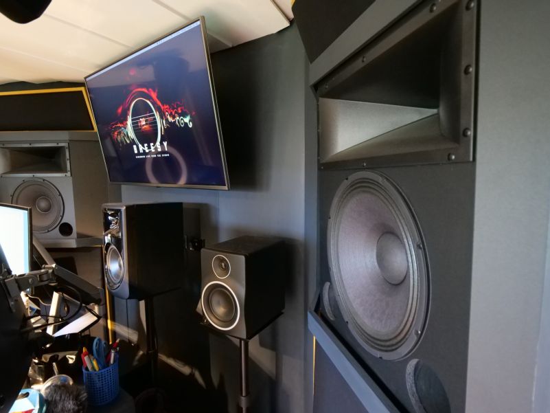 Interior view of the studio with speakers in the foreground