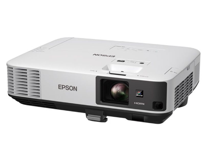 Frontal view of white Epson projector often used in business settings like meeting rooms