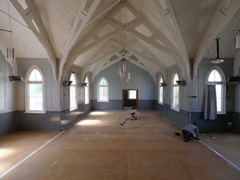Image of the church's main hall, flooring removed, with foil loop installed on the ground