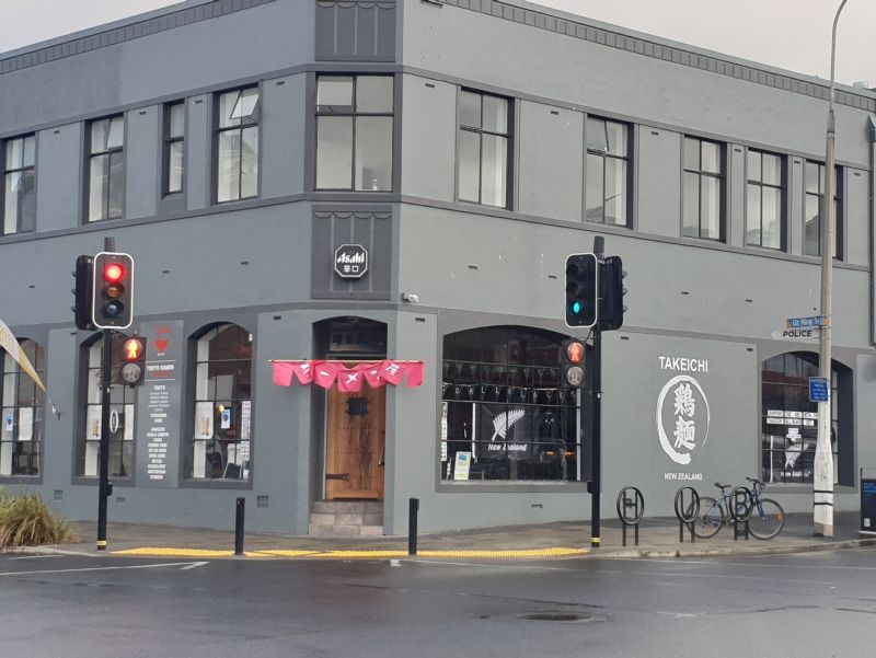 Exterior image of the building that houses Takeichi Restaurant on the ground floor