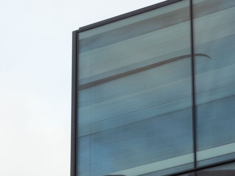 Shows the top left corner of the hotel facade, with Simon Kaan's artwork printed onto the glass-only frontage